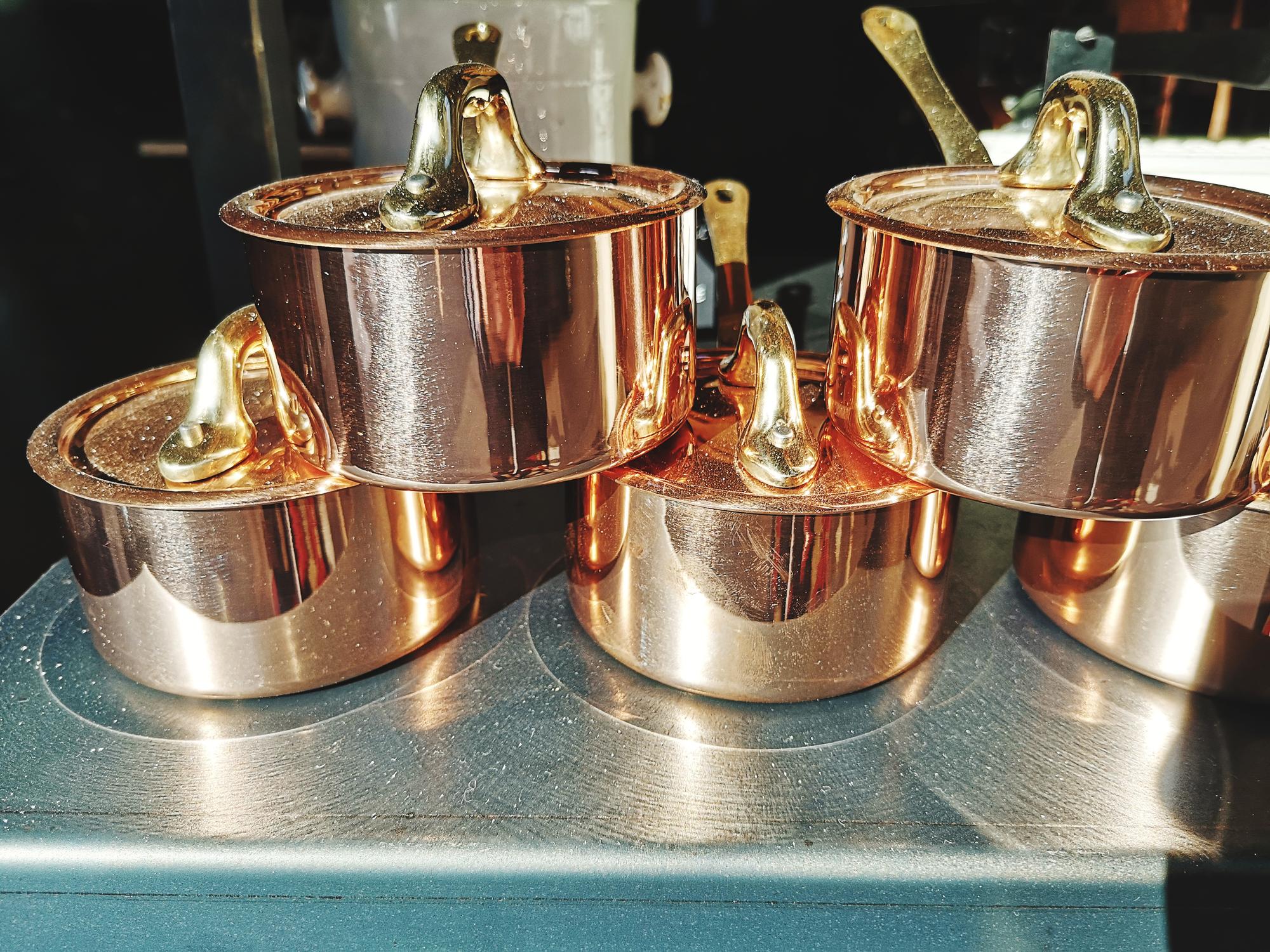 Interior of gourmet test kitchen with copper pots