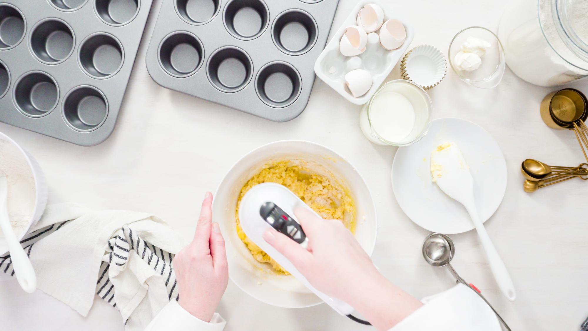 Detail of hand finishing a dessert