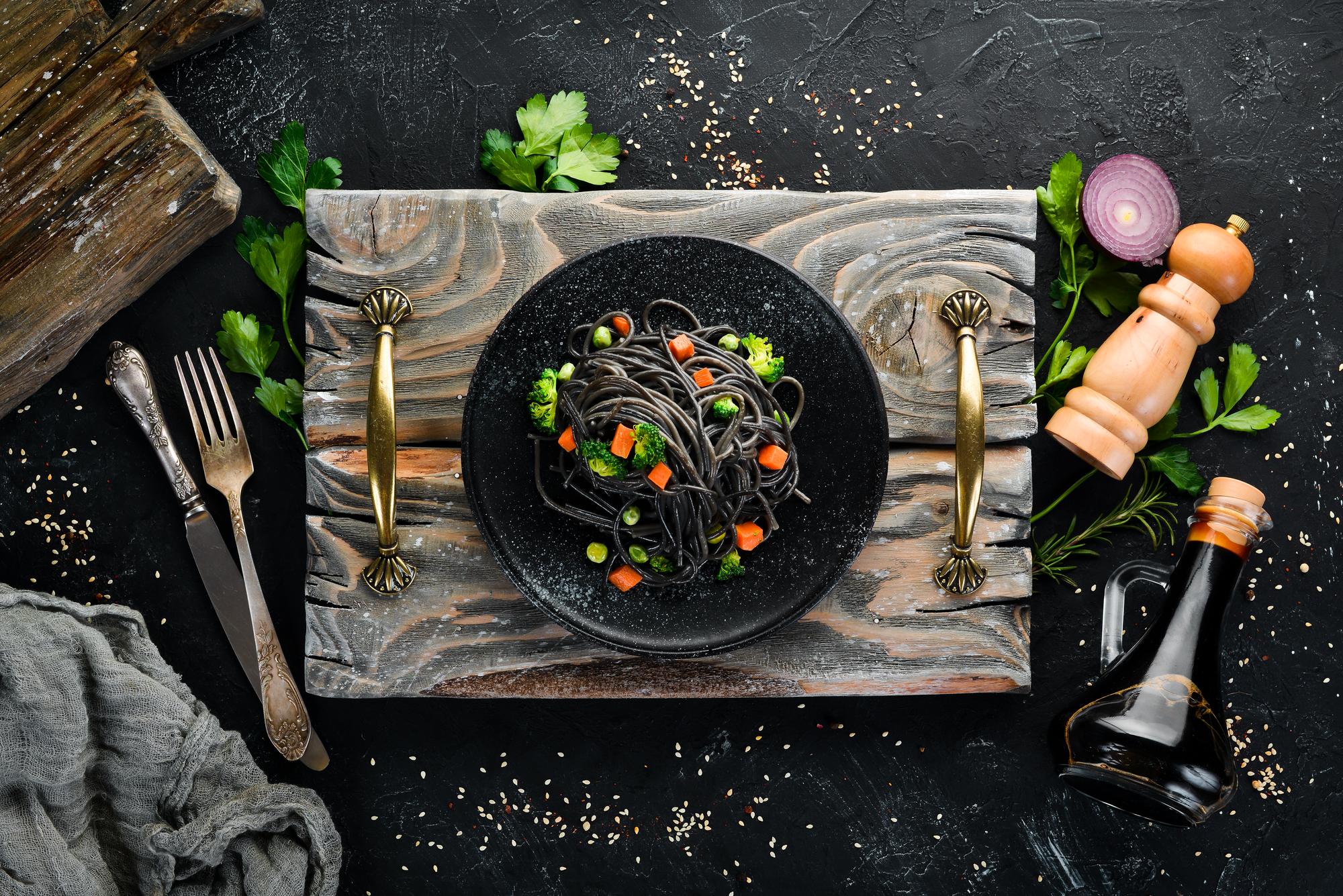 Array of plated courses on black table